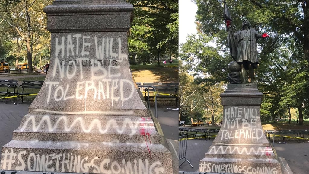 desecrated Columbus statue