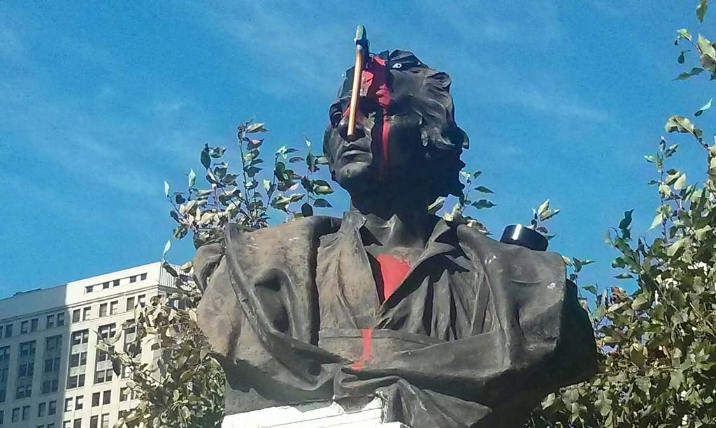 damaged Columbus statue